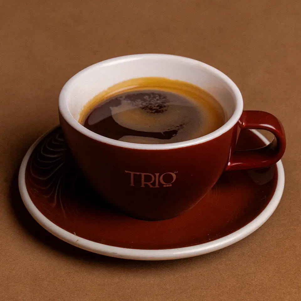 Hot Americano in a burgundy TRIO cup