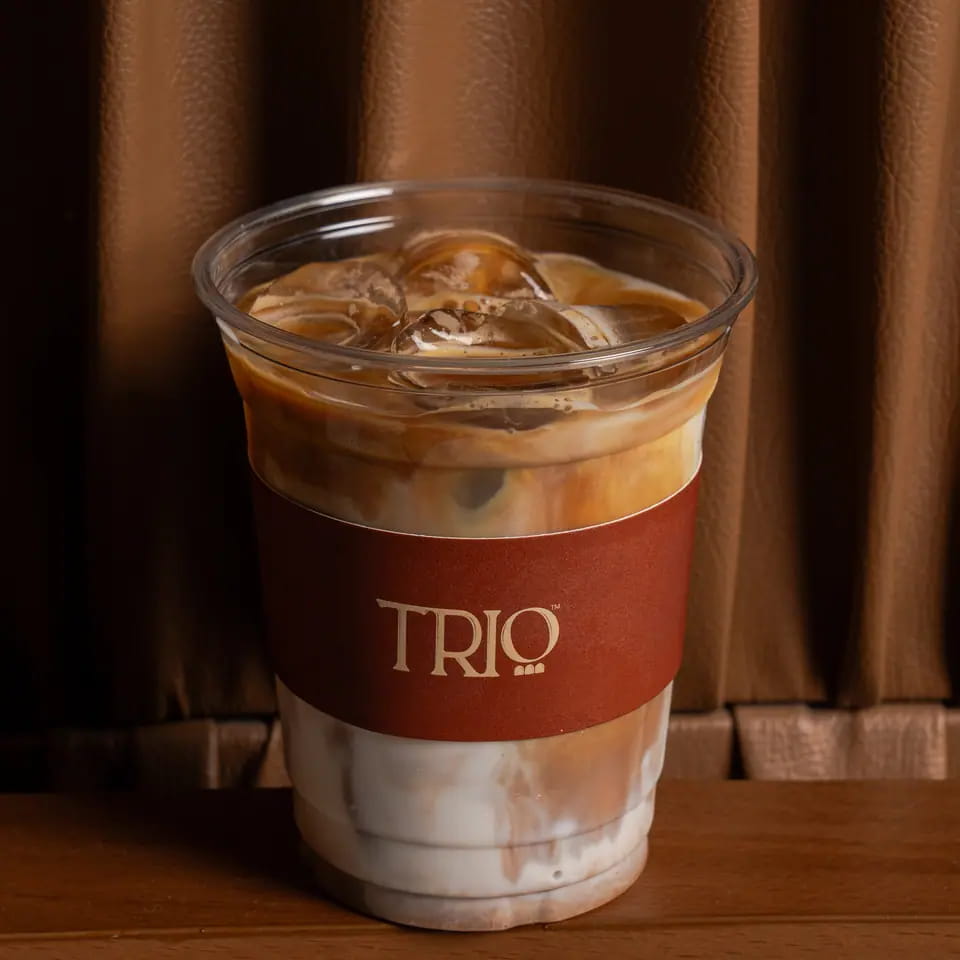 Iced latte in a TRIO takeaway cup