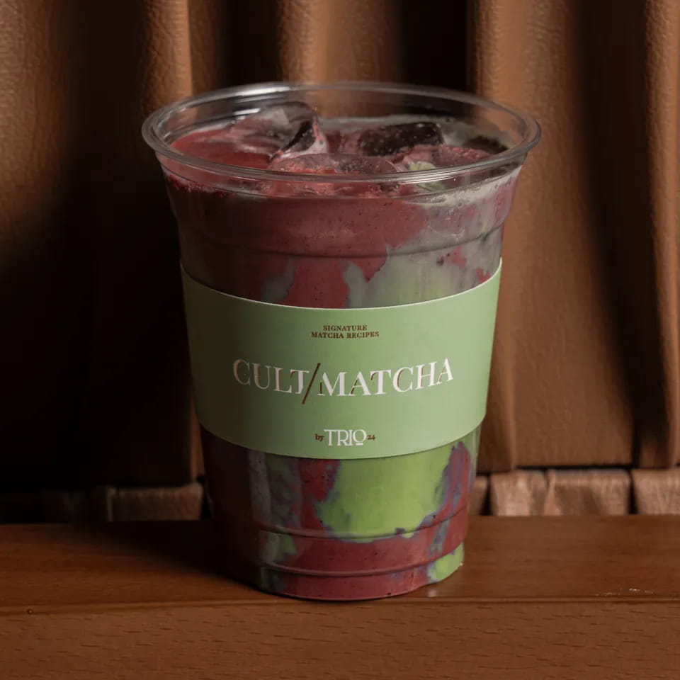 Marble blueberry matcha in a Cult Matcha takeaway cup