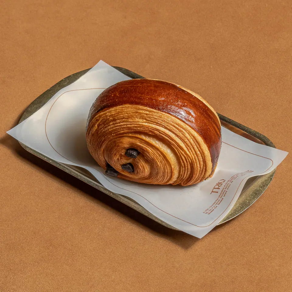 Pain au chocolat on a TRIO paper-lined tray