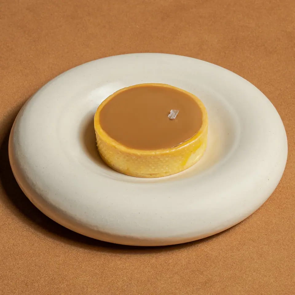 Salted caramel tart on a cream ring plate